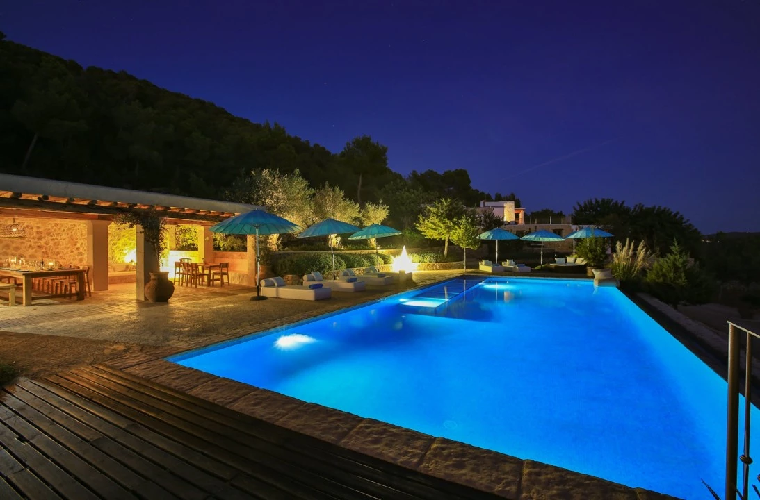 1681312932-Luxury real estate Ibiza to rent villa can Tifany spain property outside pool night.webp